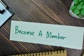 Concept of Become A member write on sticky notes isolated on Wooden Table Royalty Free Stock Photo