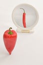 Concept Bell Pepper Reflection In Mirror on White Background