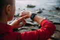 Concept of Biohacking, Modern Technology in Health and Sports. Woman Uses a Smartwatch on Her Hand to Train Healthy Lifestyle, Royalty Free Stock Photo