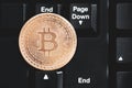 Concept bitcoin cryptocurrency virtual cash. btc coin lays at black keyboard. rip bitcoin collage. toned matte. dramatic light. lo