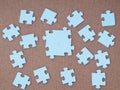 Concept of blue puzzle pieces on brown background Royalty Free Stock Photo