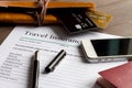 Concept booking travel insurance on wooden background