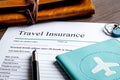 Concept booking travel insurance on wooden background