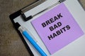 Concept of Break bad habits write on sticky notes isolated on Wooden Table Royalty Free Stock Photo
