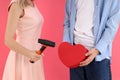 Concept of break heart with couple on pink background