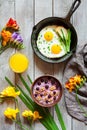 Concept of breakfast with spring mood, oatmeal and fried eggs