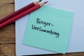Concept of Burger Versammlung in Language Germany write on sticky notes isolated on Wooden Table Royalty Free Stock Photo