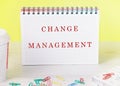 The concept of business and development. The conceptual label CHANGE MANAGEMENT it is written in a notebook on a yellow Royalty Free Stock Photo