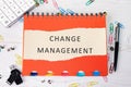 The concept of business and development. The conceptual label CHANGE MANAGEMENT written on a piece of paper from a Royalty Free Stock Photo