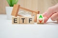 Concept business etf concept on wooden cubes