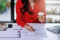 Concept of business office woman working,Close up businesswoman checking her invesment plan with analyzing document and business Royalty Free Stock Photo