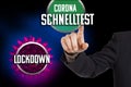 Concept: Buttons with the Word Lockdown and the German word Corona Schnelltest Antigen Rapid Test