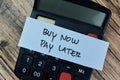 Concept of Buy Now Pay Later write on sticky notes isolated on Wooden Table Royalty Free Stock Photo