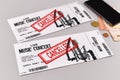 Concept for cancelled entertainment events with concert tickets and red `cancelled` stamp on them Royalty Free Stock Photo