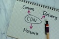 Concept of CDR - Content Delivery Network write on a book with statistics isolated on Wooden Table