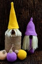 Concept celebration winter seasonal  two violet and yellow Christmas gnome ornament Royalty Free Stock Photo