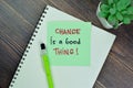 Concept of Change is a Good Thing! write on sticky notes isolated on Wooden Table Royalty Free Stock Photo