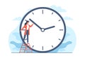 Concept of changing to summer or winter time, woman changes hand of clock. Wintertime and summertime setting. Clock to