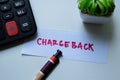 Concept of Chargeback write on sticky notes isolated on Wooden Table Royalty Free Stock Photo