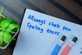 Concept of Always Check For Spelling Errors write on book isolated on Wooden Table