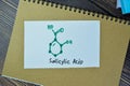 Concept of chemical molecular formule hormone Salicylic Acid write on sticky notes isolated on Wooden Table