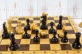 Concept of chess game with realistic Board and black-and-white figures against the light boards. Royalty Free Stock Photo