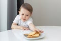 The concept of children and sweets. Cute little boy craves cookies, sweet tooth