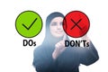 Concept of choosing between dos and donts Royalty Free Stock Photo