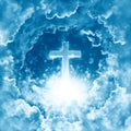 Concept of christian religion shining cross on the background of dramatic cloudy sky. Divine shining heaven, light. Sky with cross Royalty Free Stock Photo