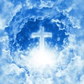 Concept of christian religion shining cross on the background of dramatic cloudy sky. Divine shining heaven, light. Sky with cross Royalty Free Stock Photo