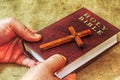 Concept: Christian religion and traditions. Wood Symbol of Christianity Christian Cross and English Vintage Book Holy Bible Royalty Free Stock Photo