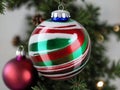 A Christmas Orname With A Red And Green Striped Orname. Generative AI