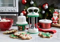 A Christmas-Themed Cookie Press Set, On A Kitchen Counter. Generative AI