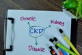 Concept of CKD - Chronic Kidney Disease write on paperwork isolated on Wooden Table