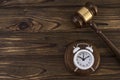 The concept of a clock and a hammer by the judge. Royalty Free Stock Photo