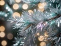 A Close Up Of A Christmas Tree With Lights In The Background. Generative AI Royalty Free Stock Photo