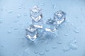 Concept of cold and refreshing. Ice cubes with water drops on a blue background Royalty Free Stock Photo