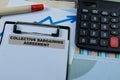 Concept of Collective Bargaining Agreement write on paperwork isolated on wooden background Royalty Free Stock Photo