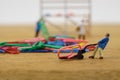 Miniature toy workers carry a paper clip Royalty Free Stock Photo