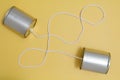 Hello, two cans connected by a string. Royalty Free Stock Photo