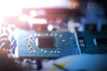 Concept of computer Technology: Close up of a computer chip on a circuit board, sunbeam Royalty Free Stock Photo