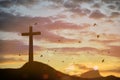 Concept conceptual black cross religion symbol silhouette in grass over sunset Royalty Free Stock Photo