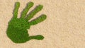 Concept or conceptual green grass handprint on hay background. A metaphor for ecology, environment, recycle, nature conservation,
