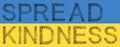 Community of people forming SPREAD KINDNESS slogan on Ukrainian flag.