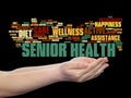 Old senior health, care or elderly people abstract word cloud held in hands