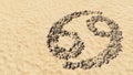 Stones on beach sand handmade symbol shape, golden sandy background, cancer zodiac sign Royalty Free Stock Photo