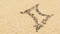 Stones on beach sand handmade symbol shape, golden sandy background, gemini zodiac sign Royalty Free Stock Photo