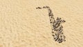 Stones on beach sand handmade symbol shape, golden sandy background, saxophone sign