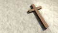 Wwooden cross on a pattern white marble background.