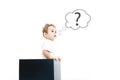 Concept for confusion, inspiration and solution. little boy looks out of the box, looking for the answer, the question mark, the